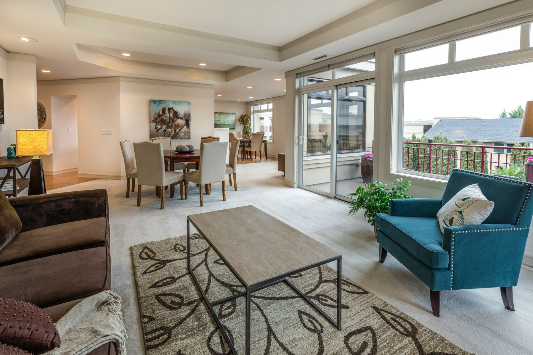 Bright, open living and dining area with large windows